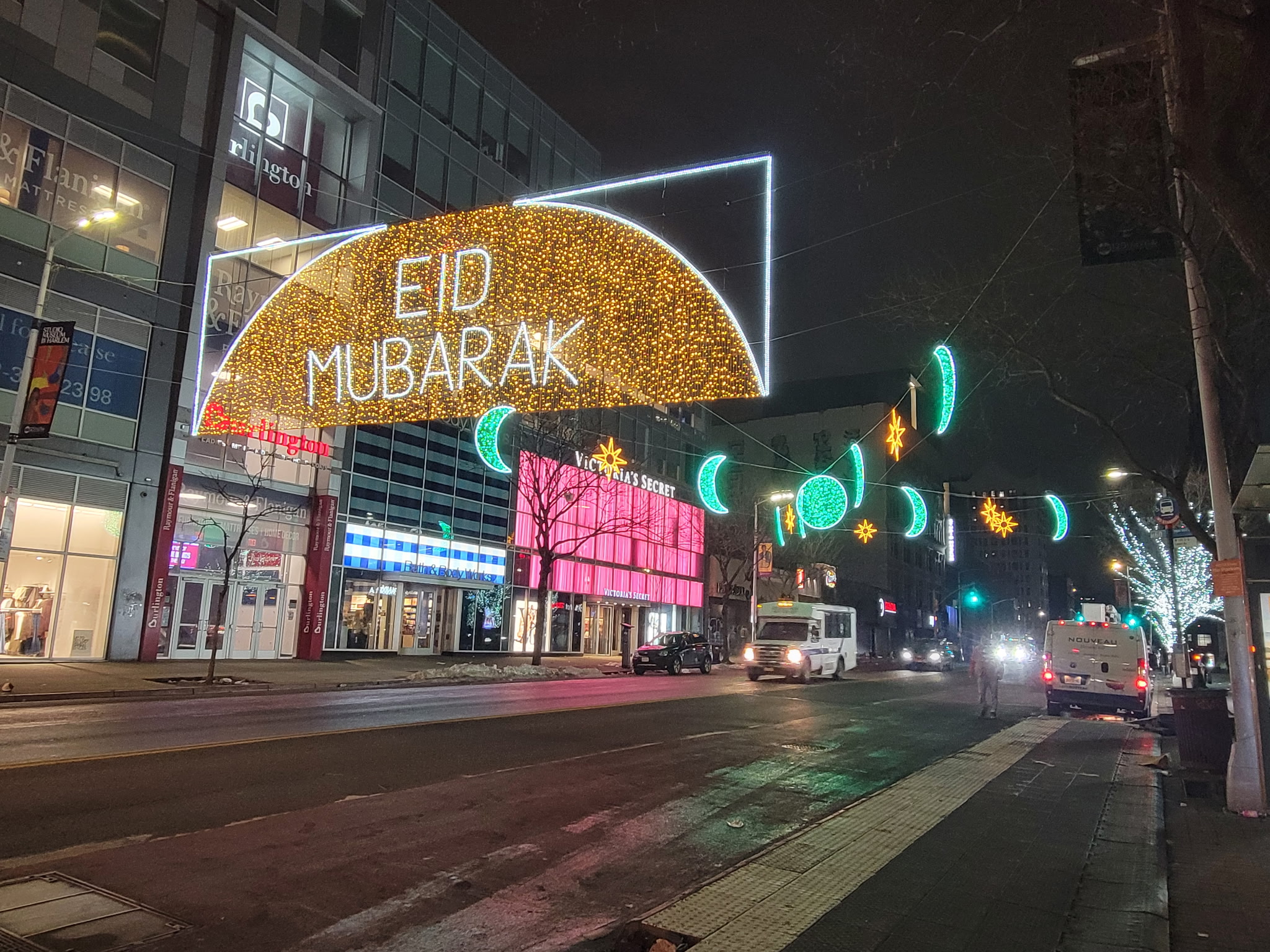 Eid Mubarak crescent moon with moon phases and stars street lighting