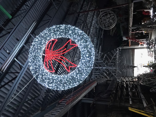 Red poinsettia ball in workshop